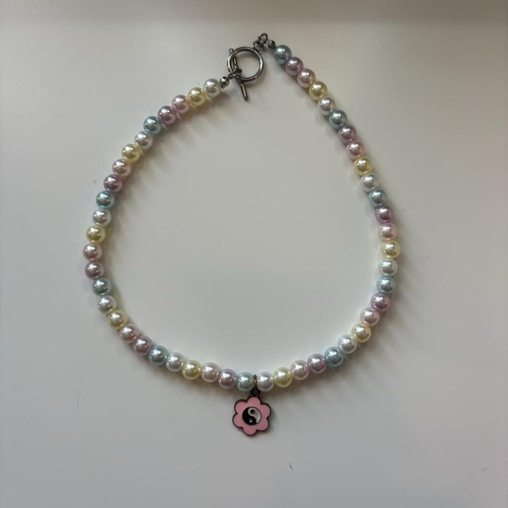 Pastel pearl choker with yin yang flower charm